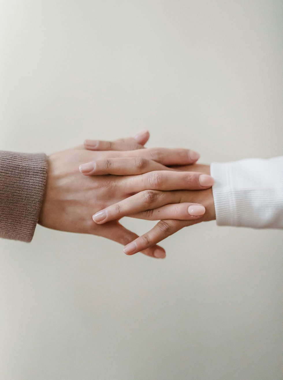 Two people holding hands