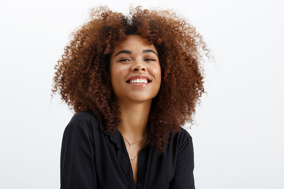 woman in black shirt smiling at camera